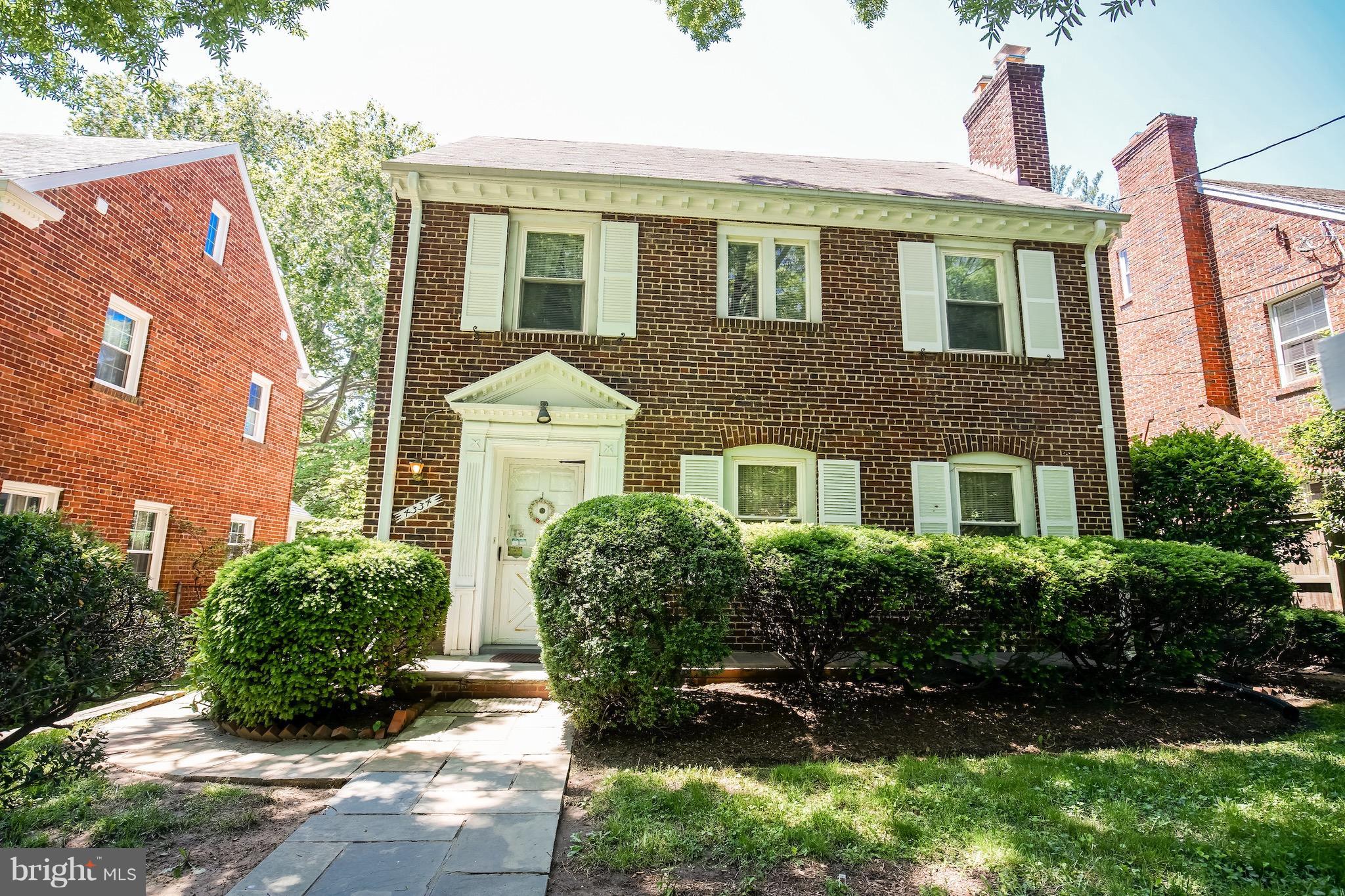 4334 Reno Road Northwest Washington, DC 20008 - Photo 1 of 16 a front view of a house with a yard