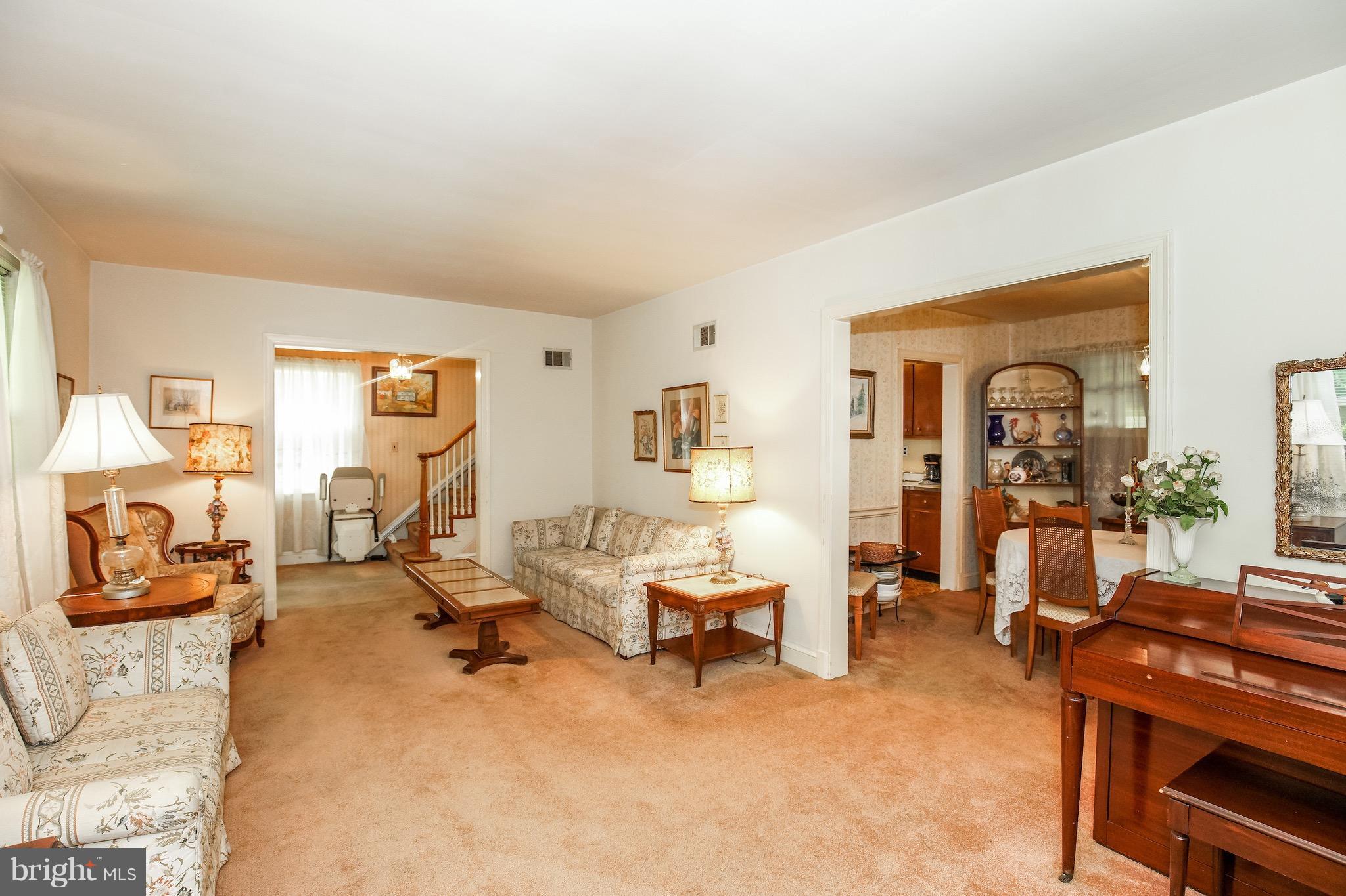 4334 Reno Road Northwest Washington, DC 20008 - Photo 3 of 16 a living room with furniture and a flat screen tv