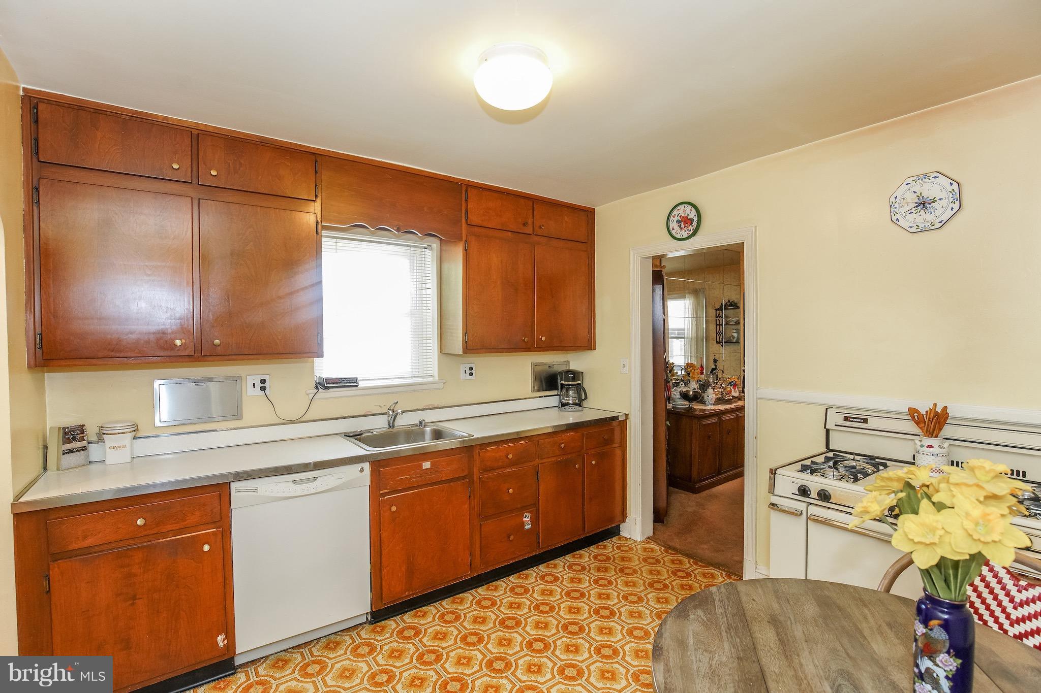 4334 Reno Road Northwest Washington, DC 20008 - Photo 6 of 16 a kitchen with a sink appliances and cabinets