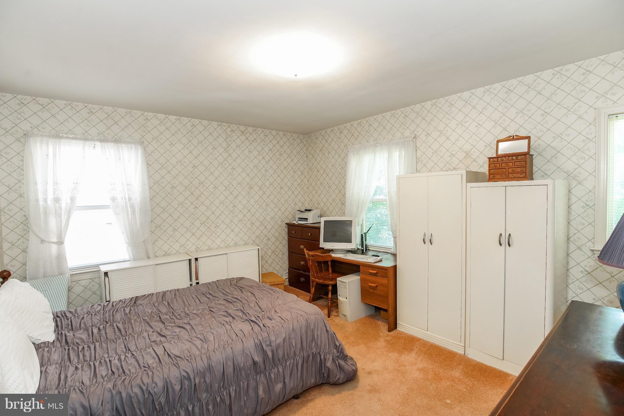 4334 Reno Road Northwest Washington, DC 20008 - Photo 10 of 16 a bedroom with a bed and a desk