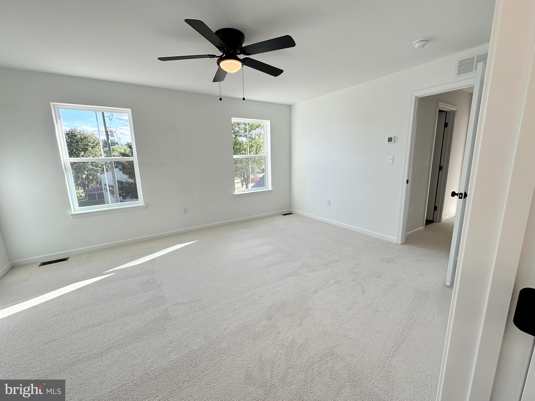 3523 Humpton Road Downingtown, PA 19335 - Photo 27 of 55 a view of a big room with windows and chandelier fan