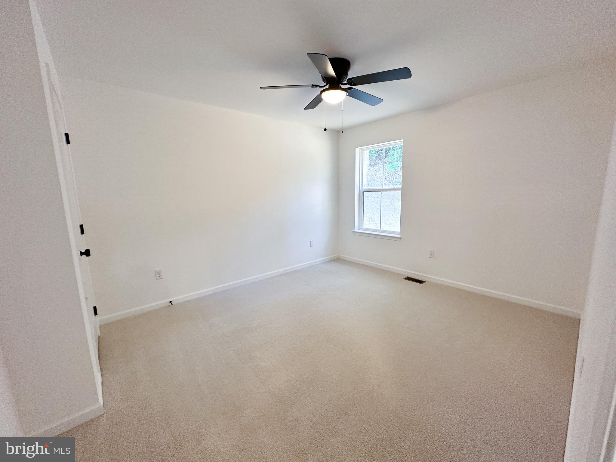 3523 Humpton Road Downingtown, PA 19335 - Photo 38 of 55 a view of a livingroom with a ceiling fan and window