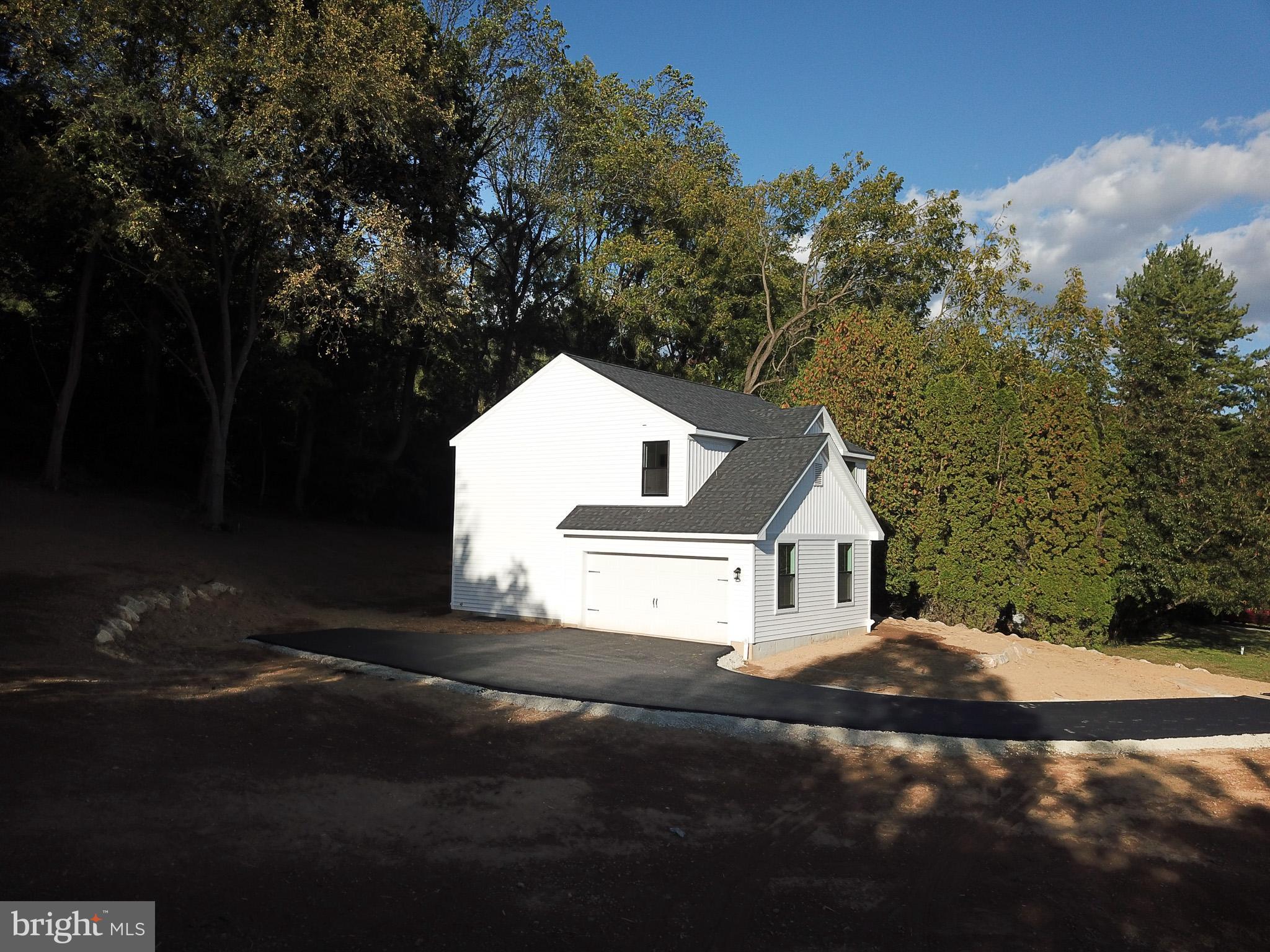 3523 Humpton Road Downingtown, PA 19335 - Photo 4 of 55 a view of a white house with a yard