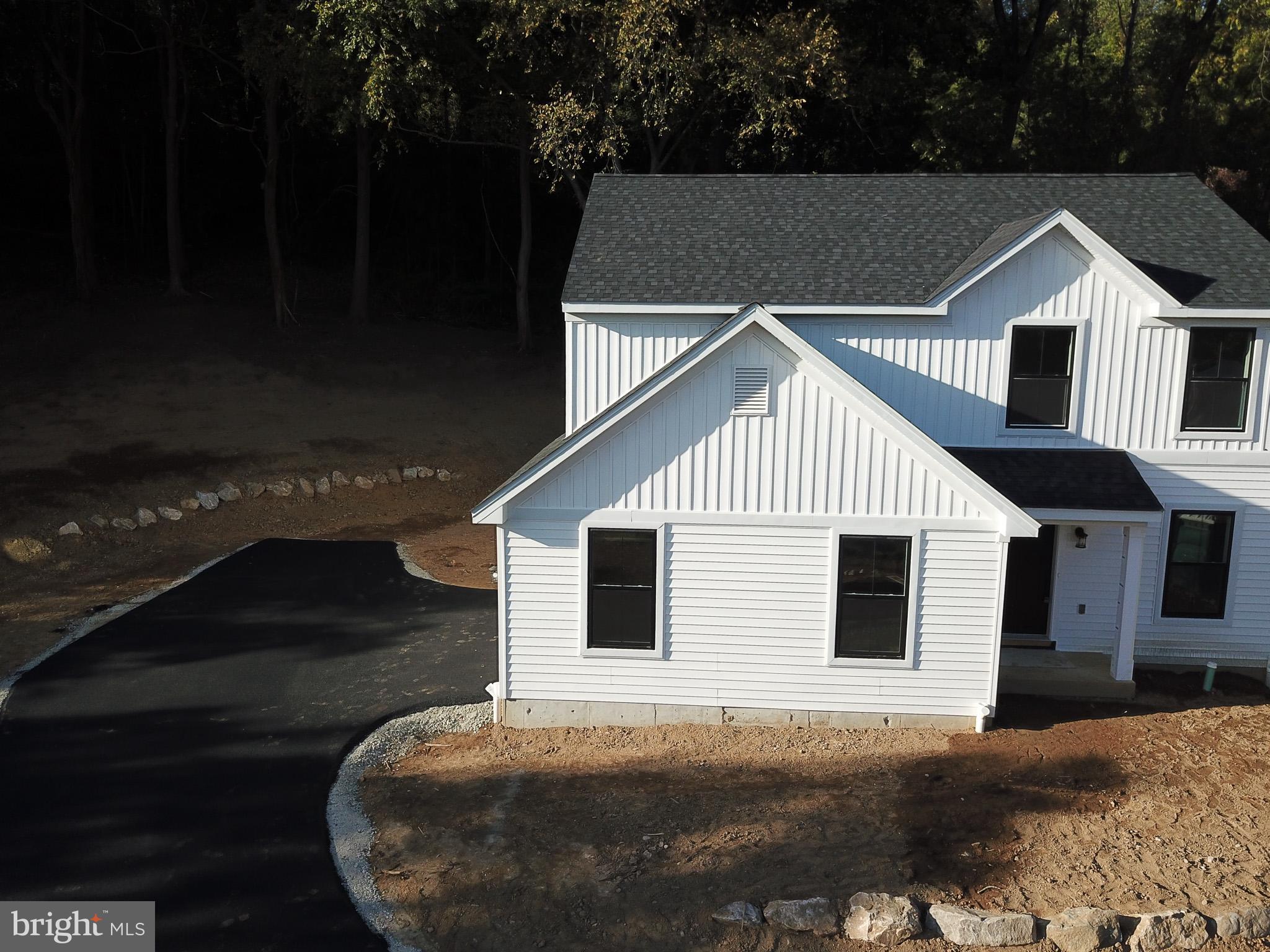 3523 Humpton Road Downingtown, PA 19335 - Photo 8 of 55 a front view of a house with a garage