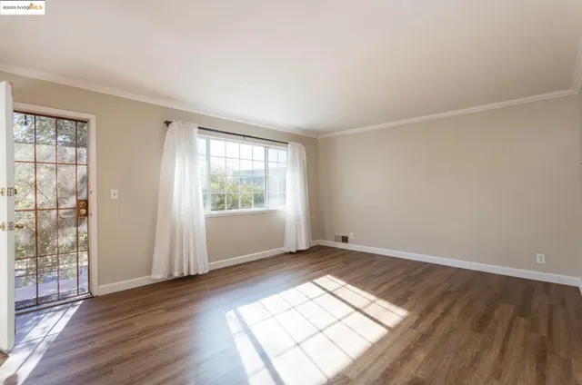 a view of an empty room and window