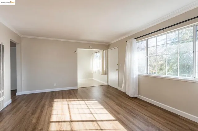 a kitchen with granite countertop white cabinets and a sink