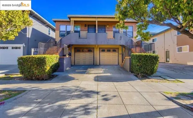 a view of a brick house with many windows