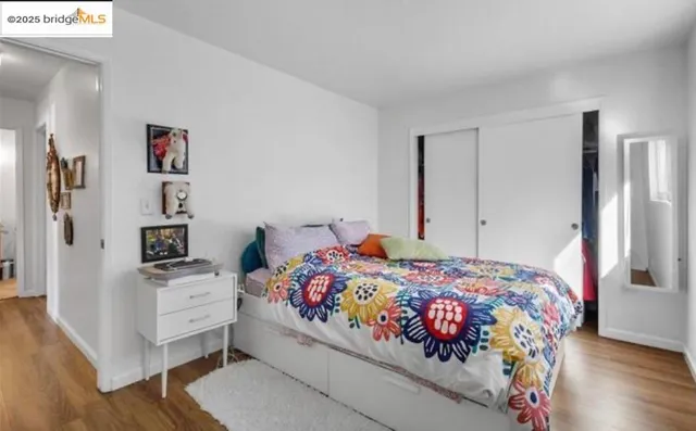 a kitchen with stainless steel appliances kitchen island granite countertop a table and chairs in it
