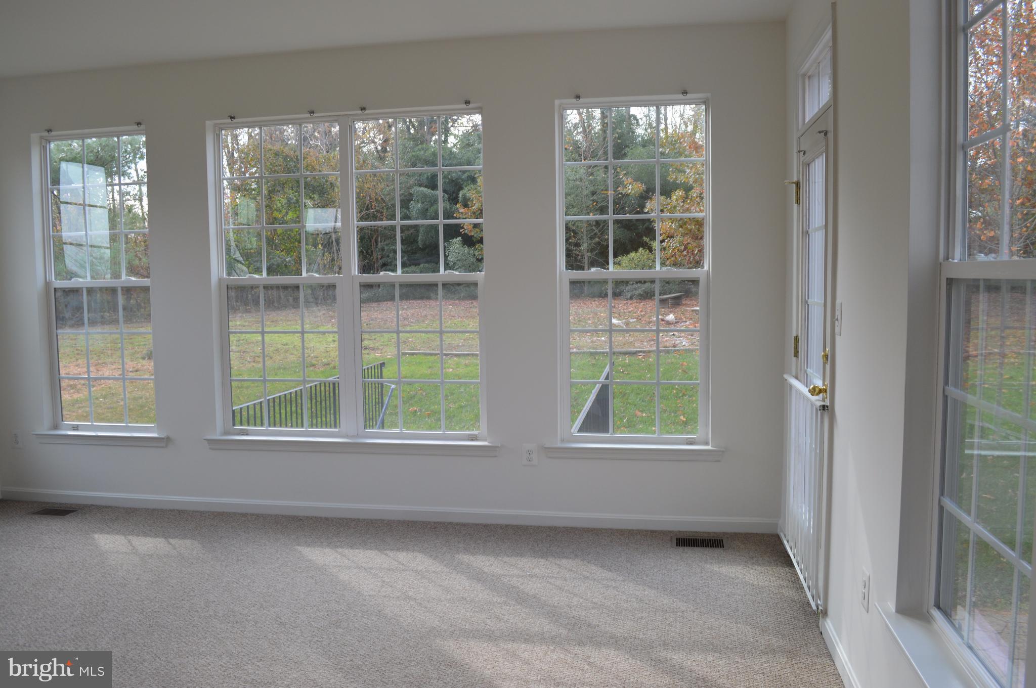 6500 Clarington Road Baltimore, MD 21209 - Photo 11 of 30 an empty room with windows