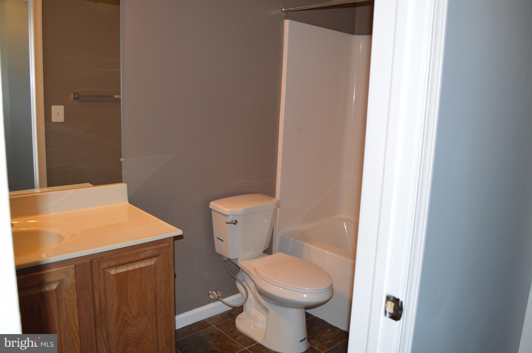 6500 Clarington Road Baltimore, MD 21209 - Photo 23 of 30 a bathroom with a sink and toilet