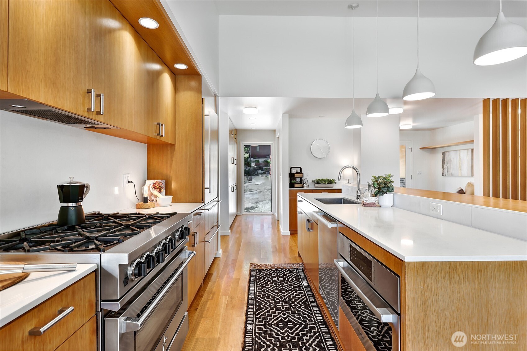 2547 Northeast 83rd Street Seattle, WA 98115 - Photo 13 of 38 a kitchen with a stove and a sink