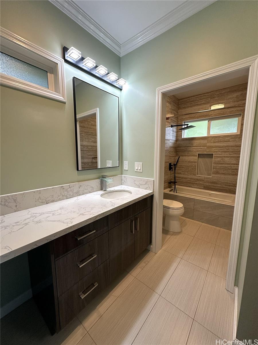 2763 Booth Road Honolulu, HI 96813 - Photo 11 of 25 a bathroom with a sink a toilet and a large mirror