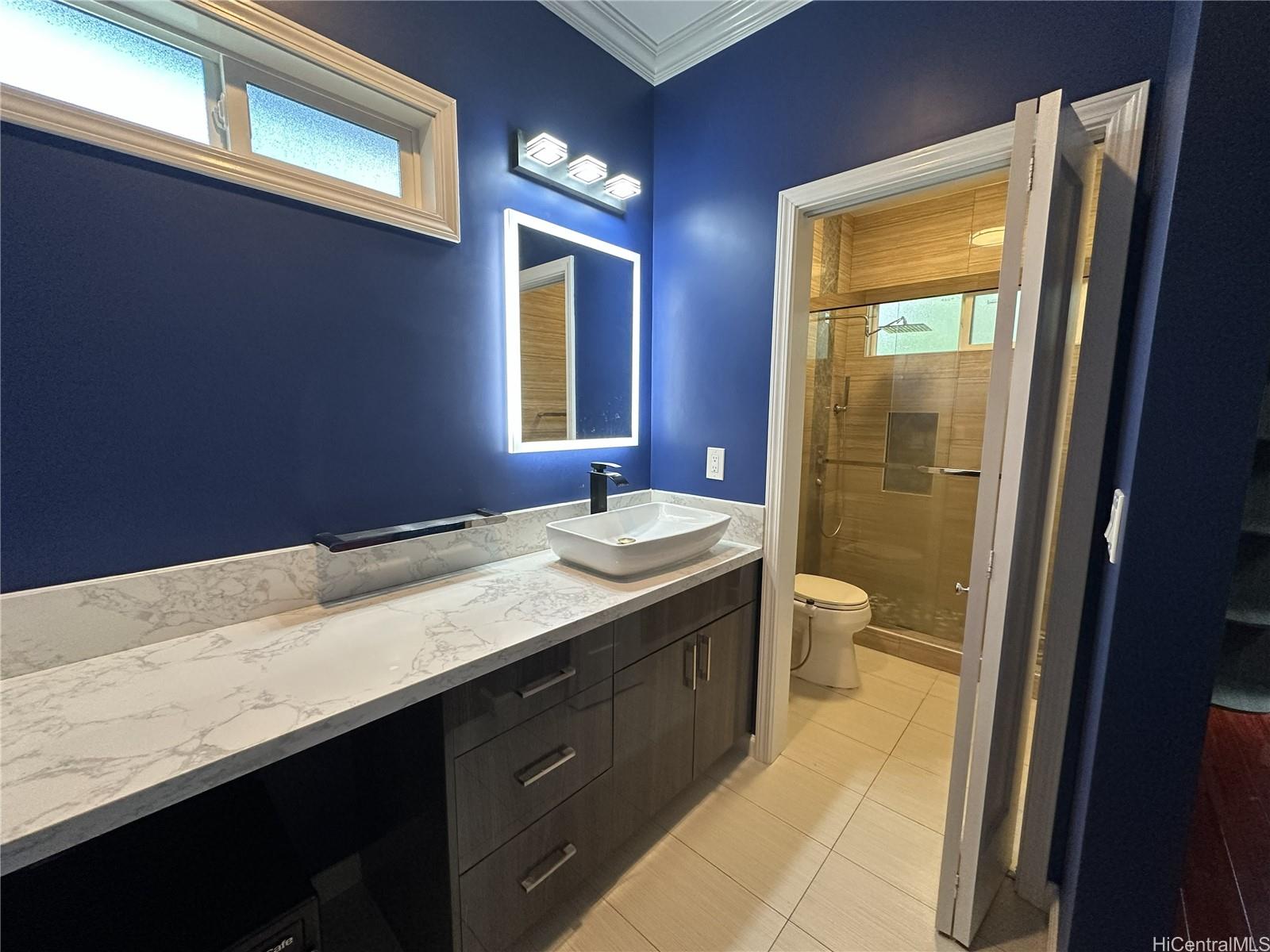 2763 Booth Road Honolulu, HI 96813 - Photo 14 of 25 a bathroom with a granite countertop sink toilet and shower