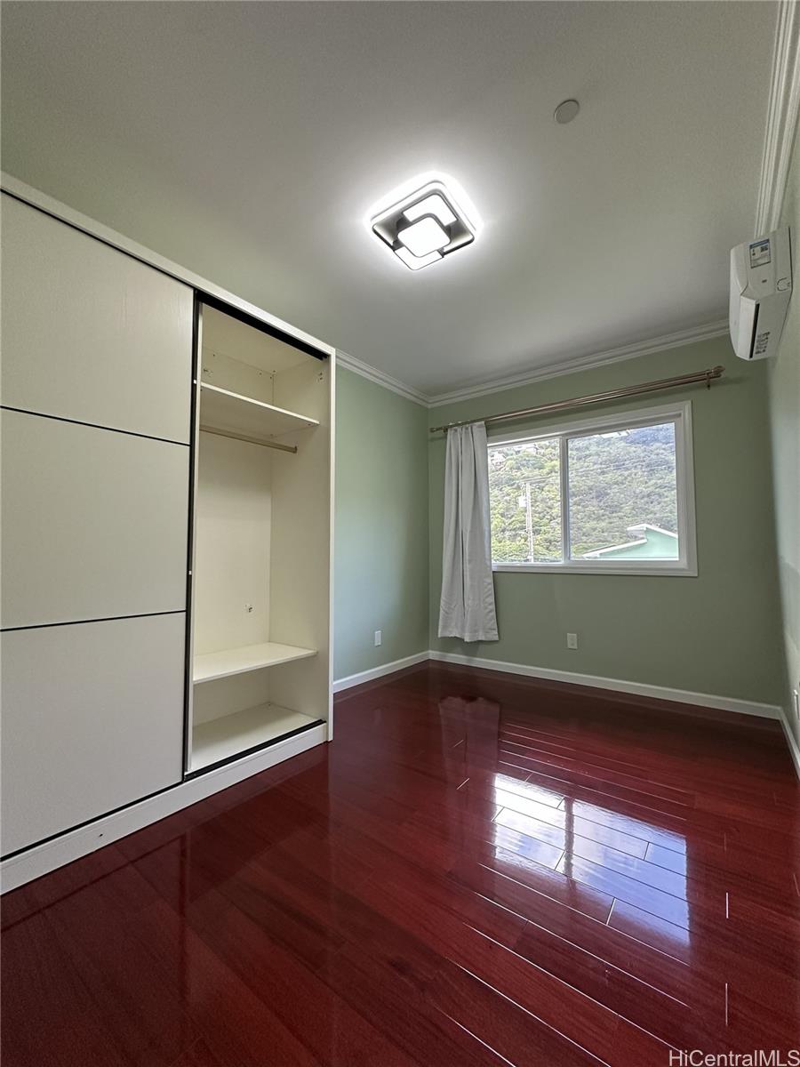 2763 Booth Road Honolulu, HI 96813 - Photo 16 of 25 an empty room with wooden floor and windows