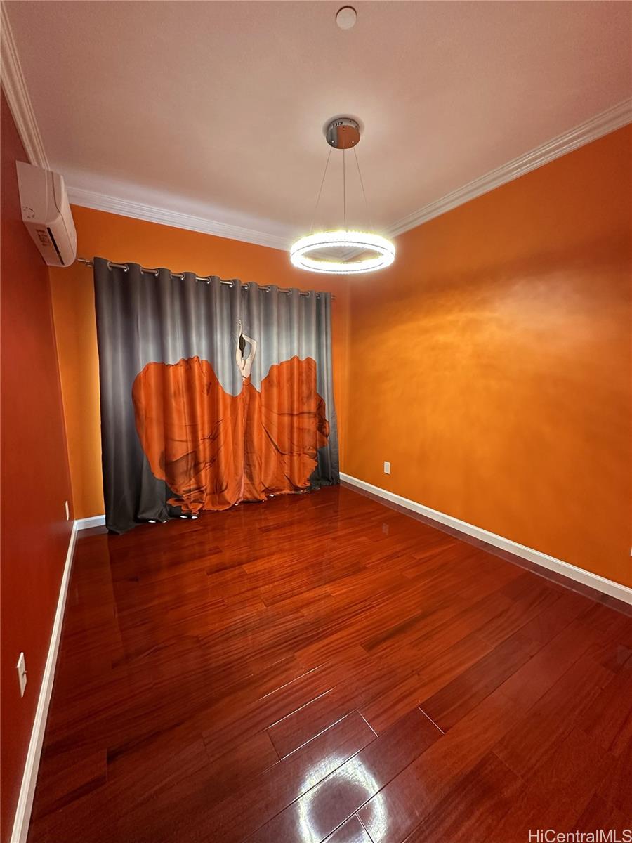 2763 Booth Road Honolulu, HI 96813 - Photo 17 of 25 an empty room with wooden floor and windows
