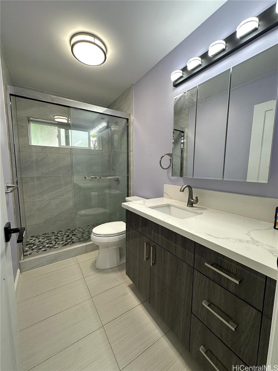 2763 Booth Road Honolulu, HI 96813 - Photo 23 of 25 a bathroom with a double vanity sink mirror and toilet