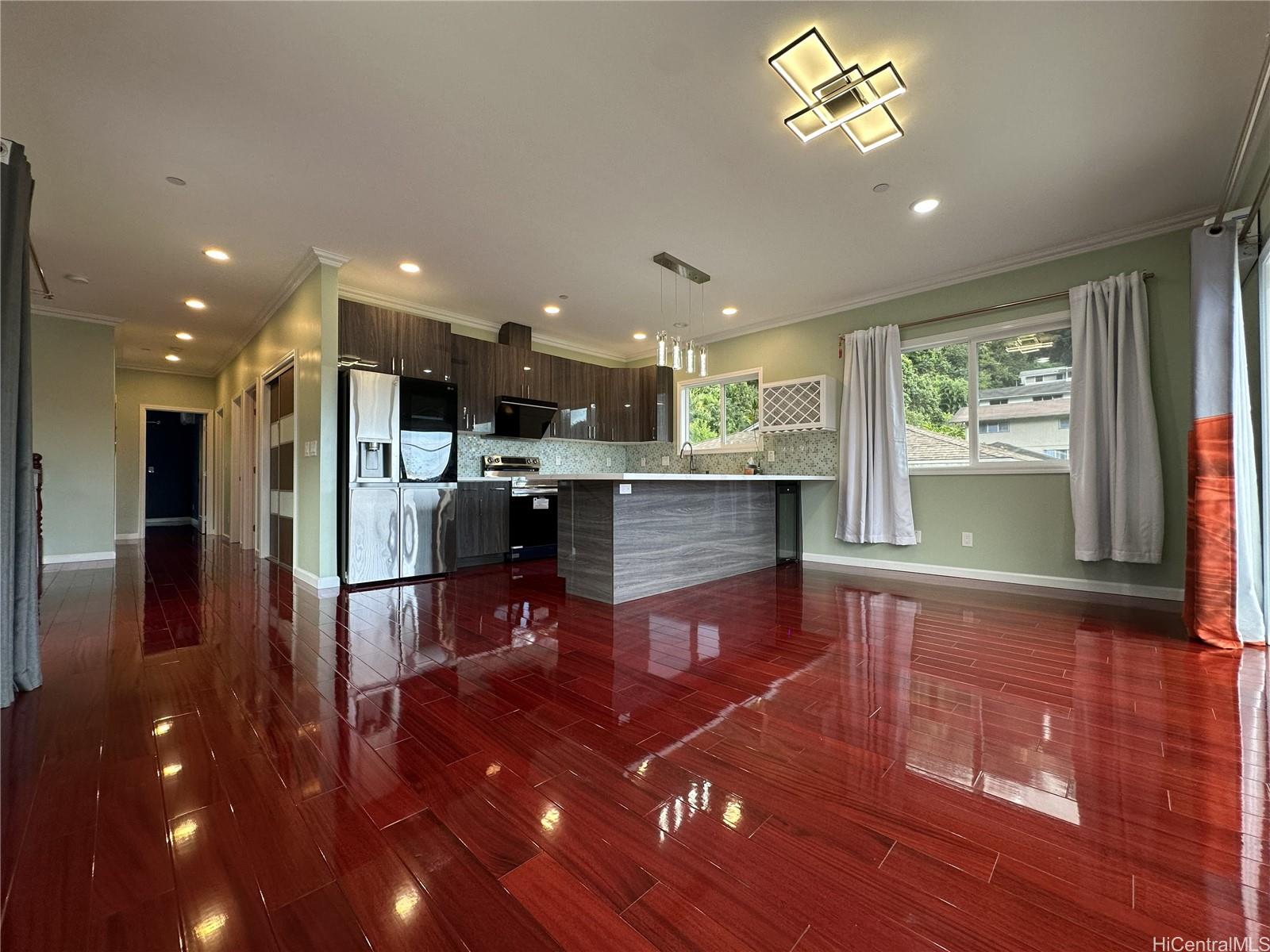2763 Booth Road Honolulu, HI 96813 - Photo 4 of 25 a living room with stainless steel appliances dining table wooden floor and a window