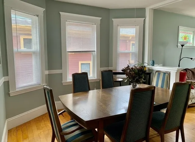 a view of a dining room with furniture and window