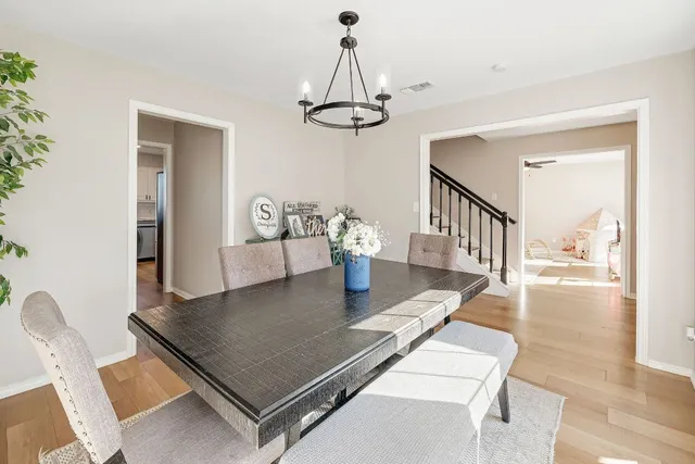 a living room with dining table