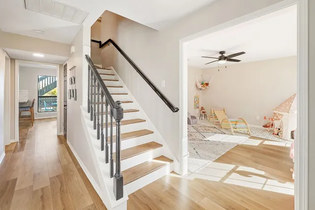 a view of entryway and hall with wooden floor
