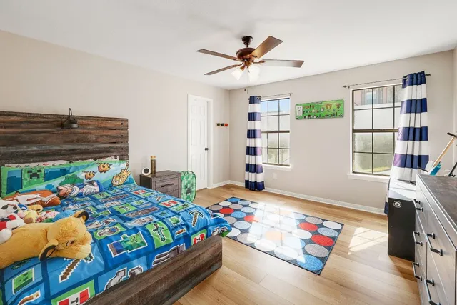 a bedroom with bed and a window