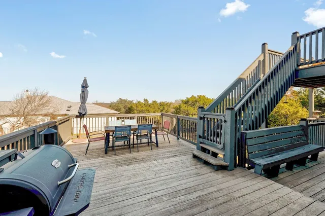 a view of a balcony with furniture