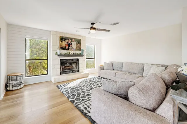 a living room with furniture and a fireplace