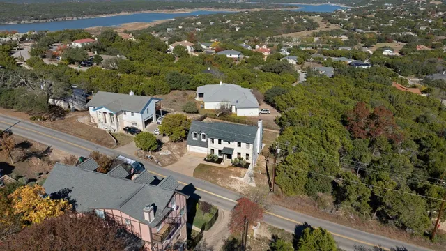 an aerial view of a house with yard