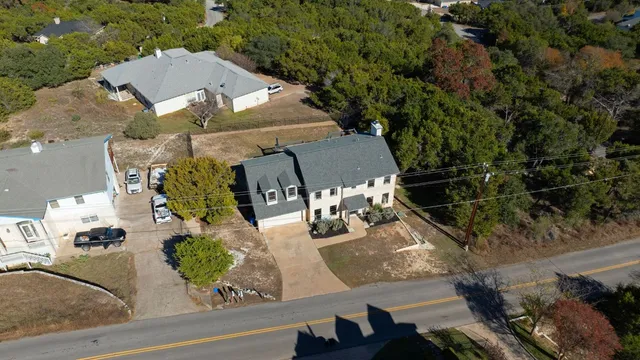 an aerial view of a house with outdoor space