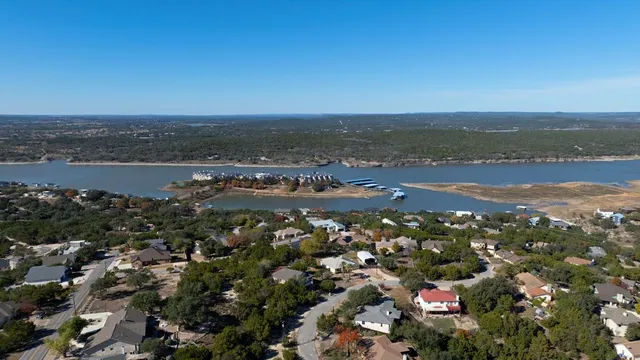 an aerial view of city and lake