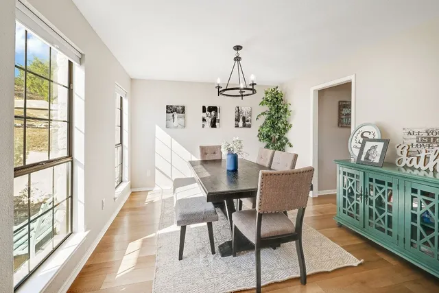 a view of a dining room with furniture window and outside view