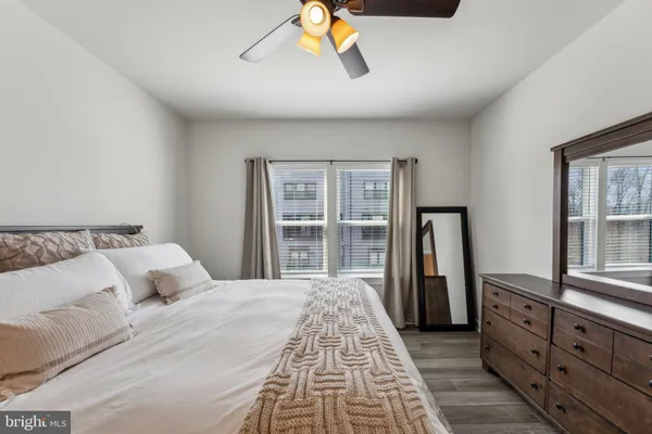 a bedroom with a bed and a dresser