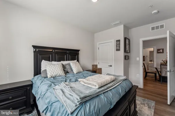 a bedroom with a bed and a dresser