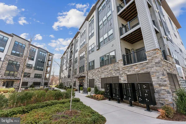 a view of brick building with many windows