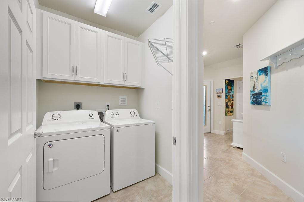 5698 Mayflower Way, Unit 403 Ave Maria, FL 34142 - Photo 19 of 27 a view of storage and utility room with washer and dryer