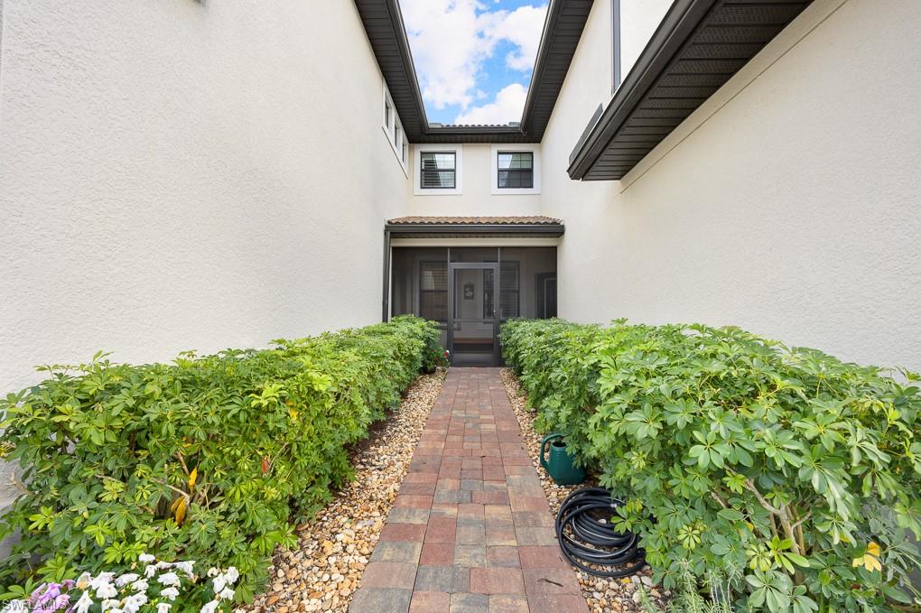 5698 Mayflower Way, Unit 403 Ave Maria, FL 34142 - Photo 21 of 27 a view of house with garden space