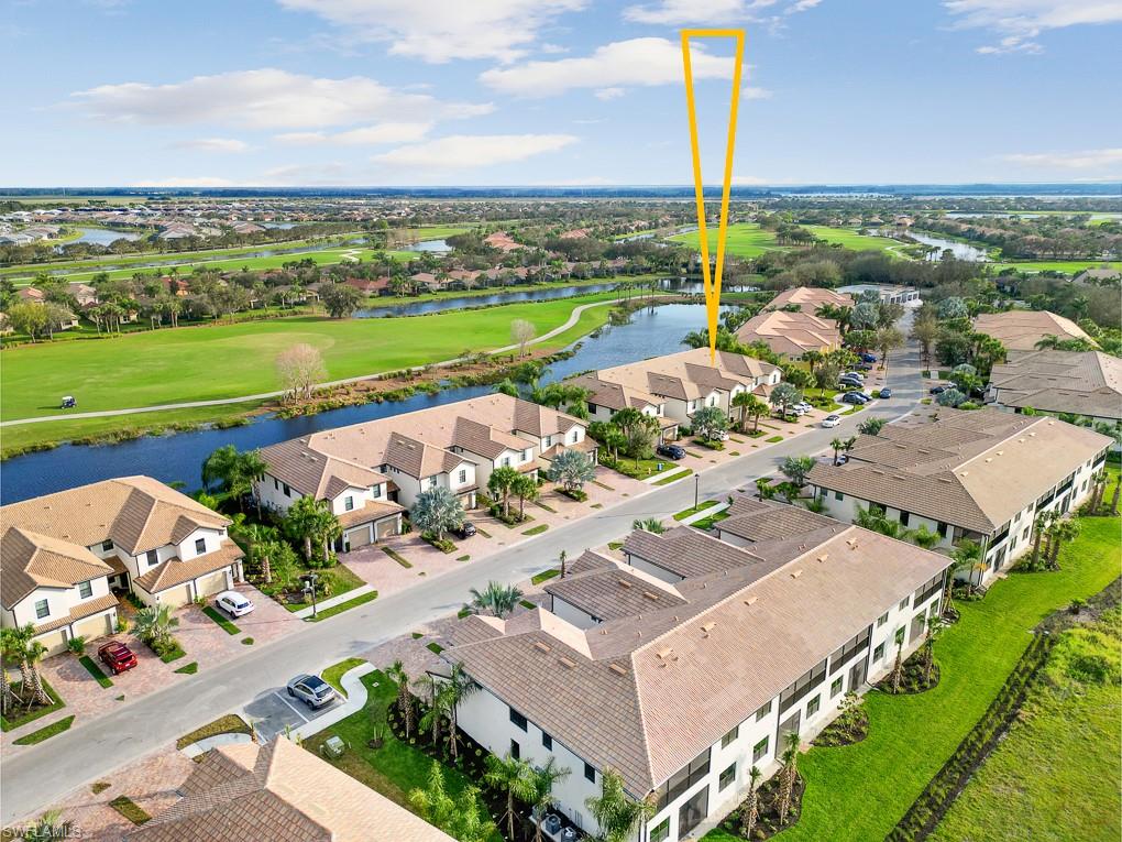 5698 Mayflower Way, Unit 403 Ave Maria, FL 34142 - Photo 24 of 27 an aerial view of a house with a garden
