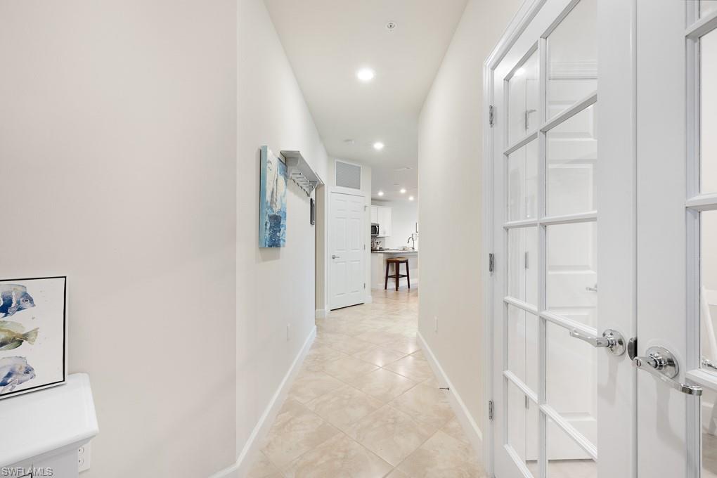 5698 Mayflower Way, Unit 403 Ave Maria, FL 34142 - Photo 3 of 27 a view of a hallway with a white walls