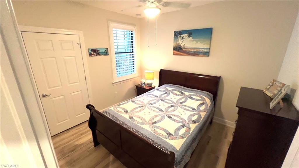 5698 Mayflower Way, Unit 403 Ave Maria, FL 34142 - Photo 6 of 27 a bedroom with a bed and a dresser