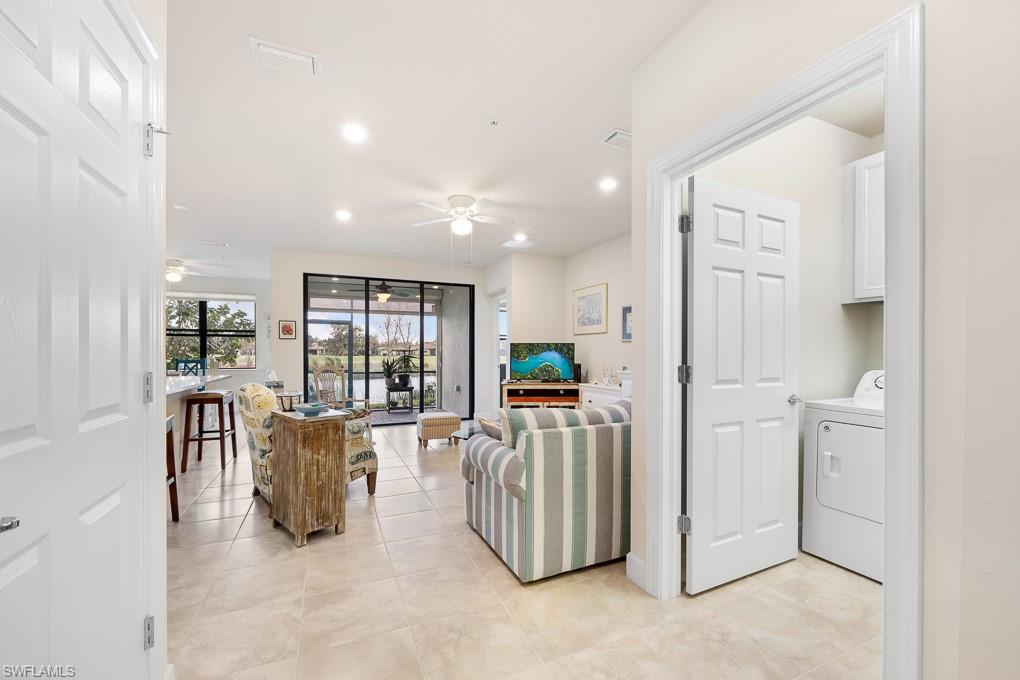 5698 Mayflower Way, Unit 403 Ave Maria, FL 34142 - Photo 7 of 27 a view of kitchen and hall with furniture