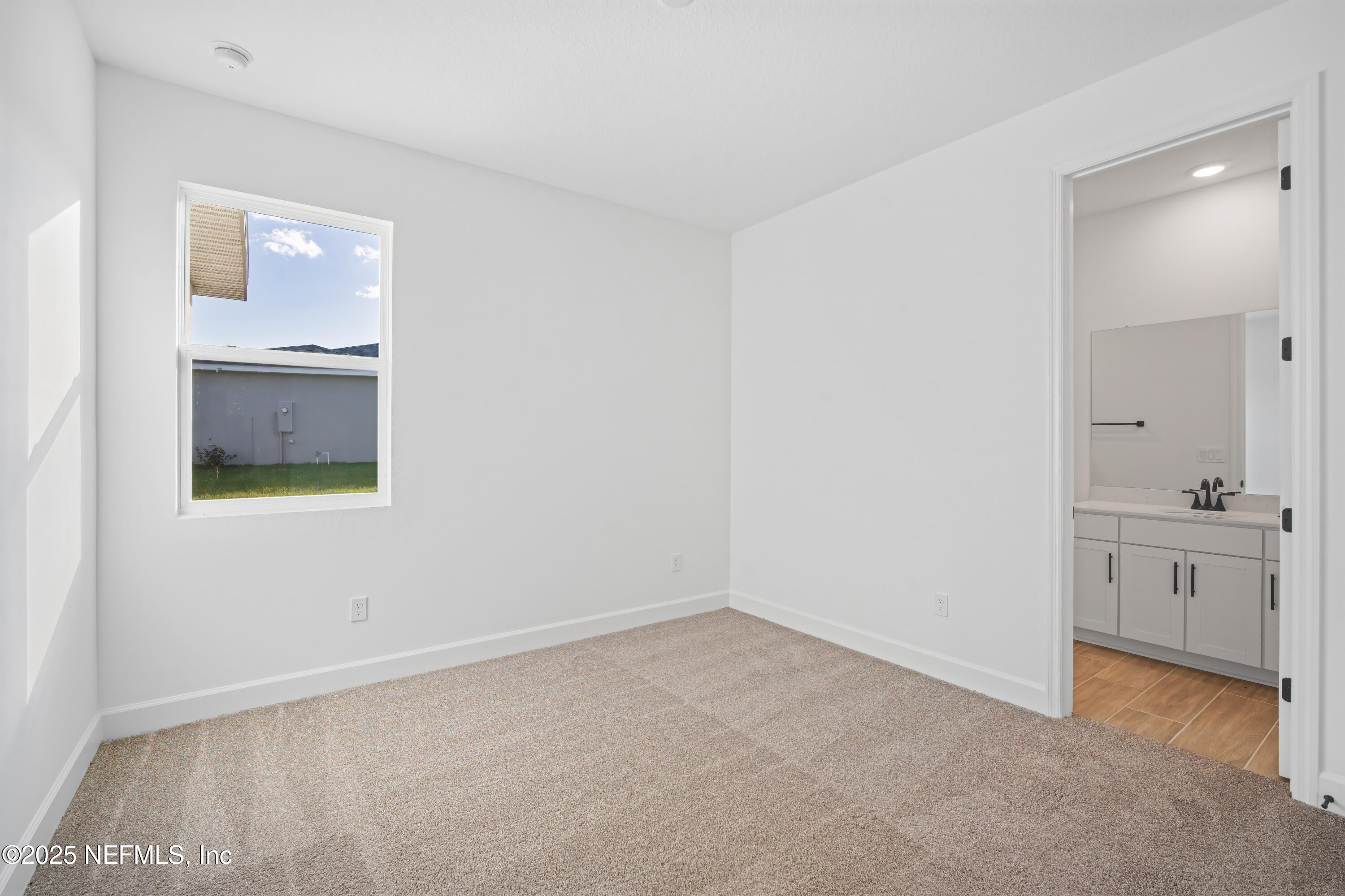 9253 Players Drive Weeki Wachee, FL 34613 - Photo 11 of 30 a view of an empty room and window
