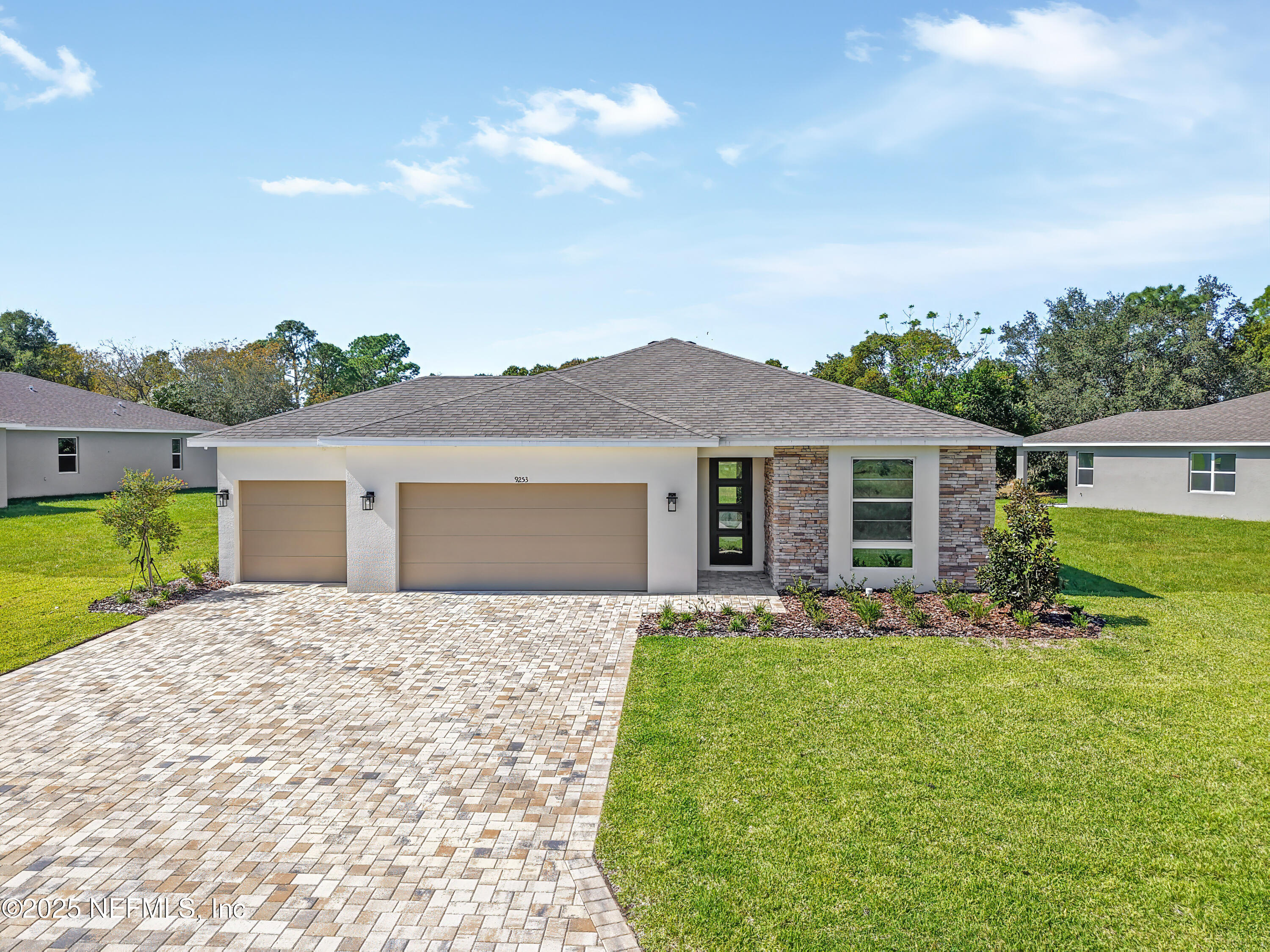 9253 Players Drive Weeki Wachee, FL 34613 - Photo 2 of 30 a front view of house with yard and green space