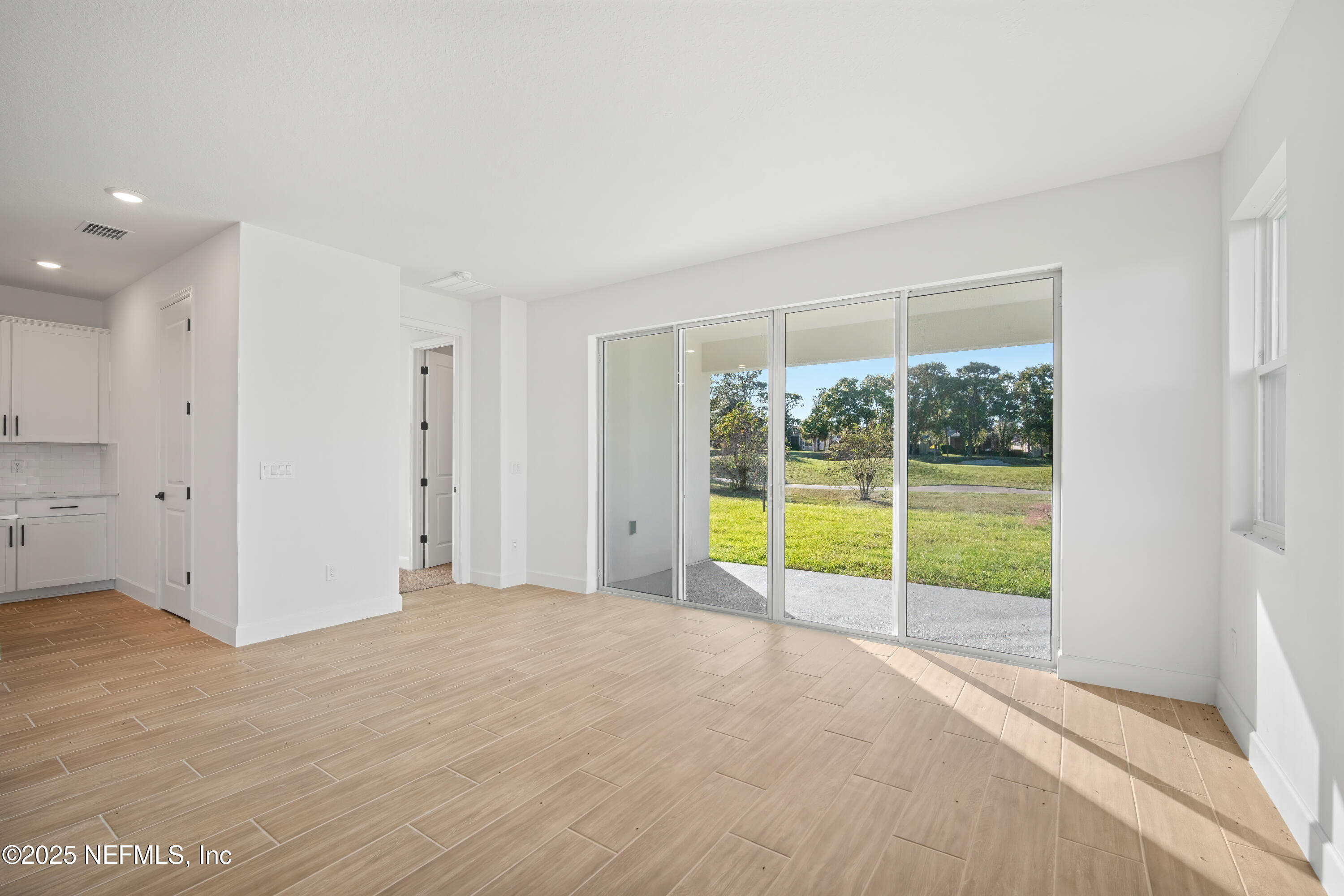 9253 Players Drive Weeki Wachee, FL 34613 - Photo 21 of 30 a view of an empty room with a window