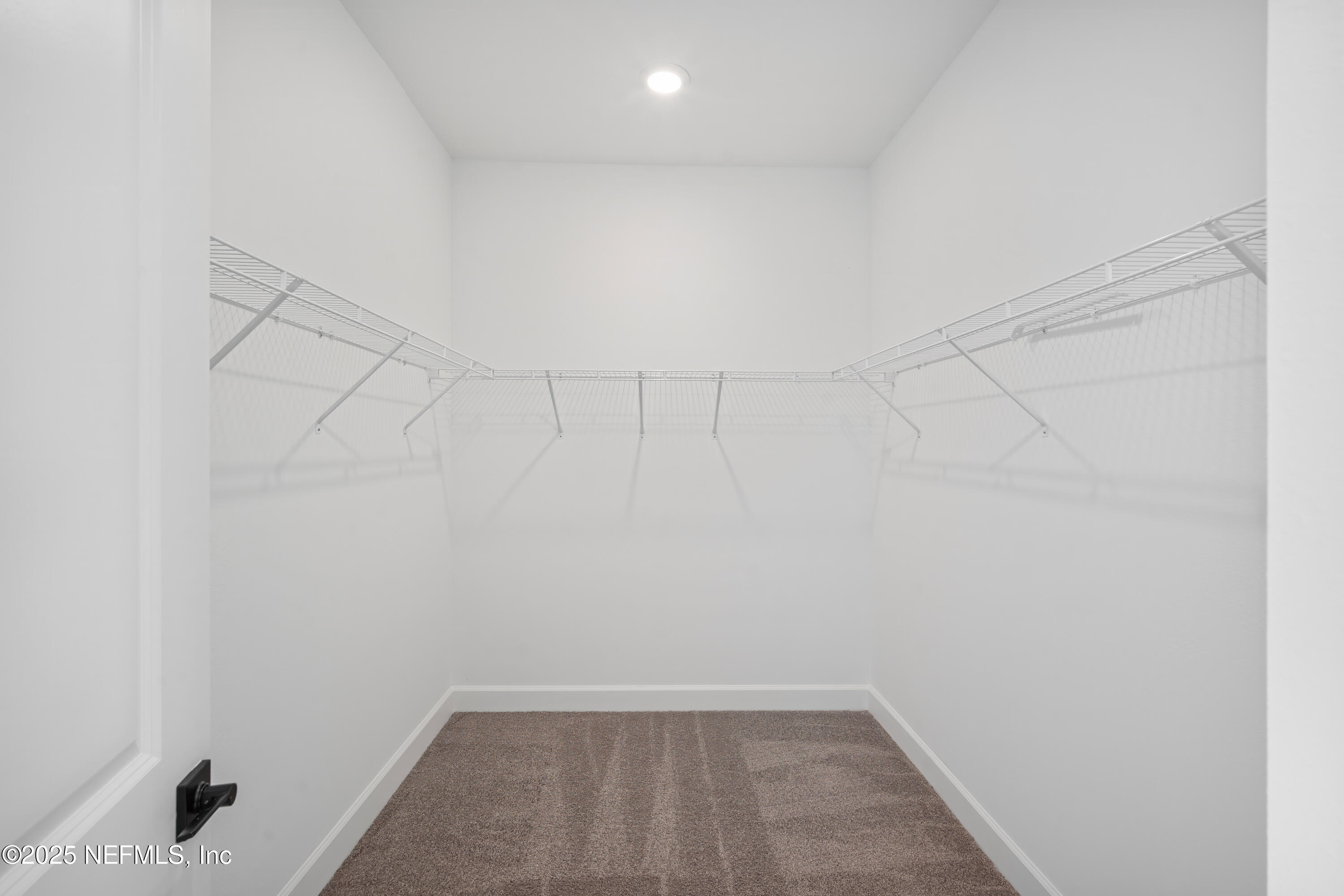 9253 Players Drive Weeki Wachee, FL 34613 - Photo 24 of 30 a view of a room with racks on the wall