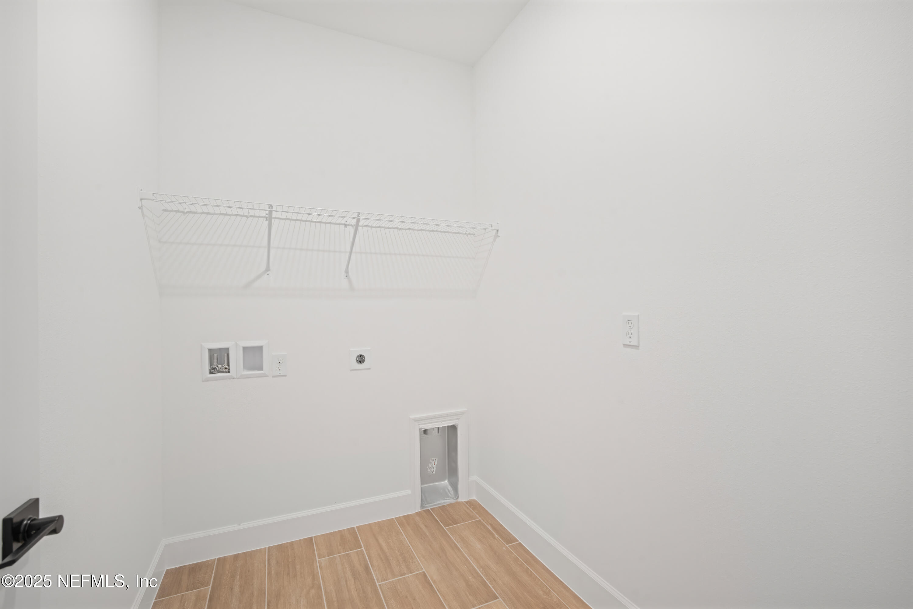 9253 Players Drive Weeki Wachee, FL 34613 - Photo 26 of 30 a view of a room with racks on the wall