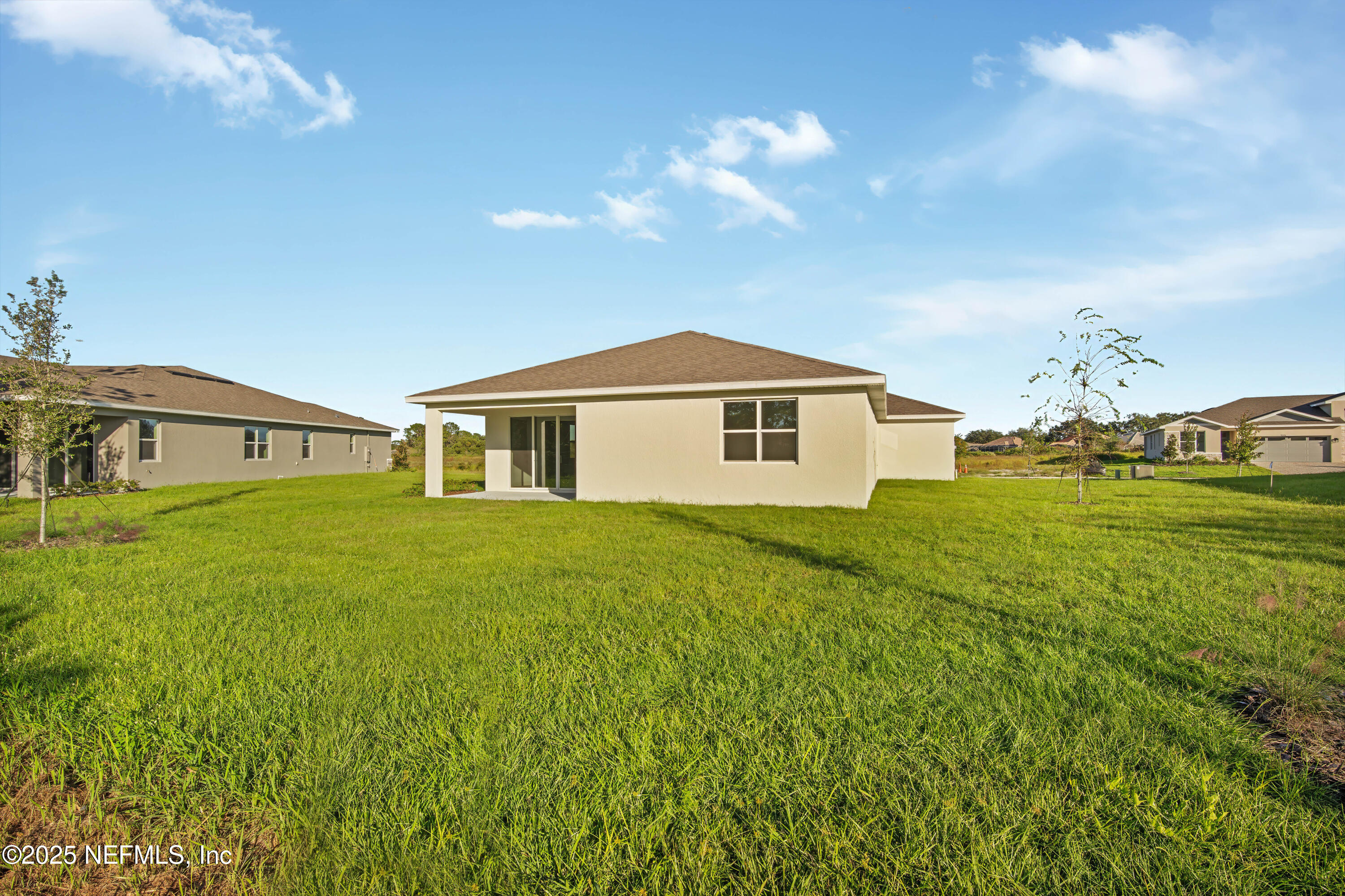 9253 Players Drive Weeki Wachee, FL 34613 - Photo 28 of 30 a front view of a house with garden
