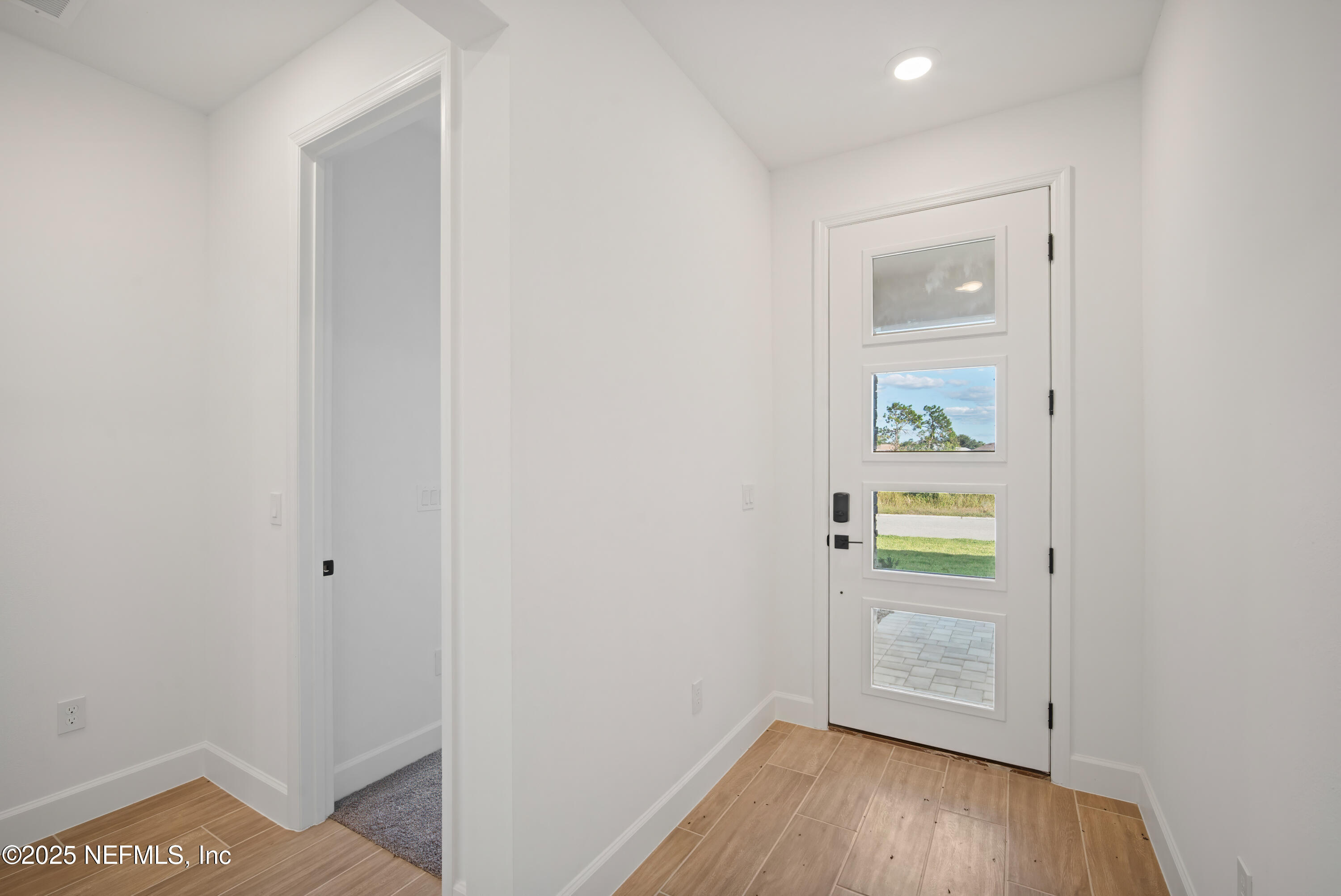 9253 Players Drive Weeki Wachee, FL 34613 - Photo 7 of 30 a view of an empty room and a window
