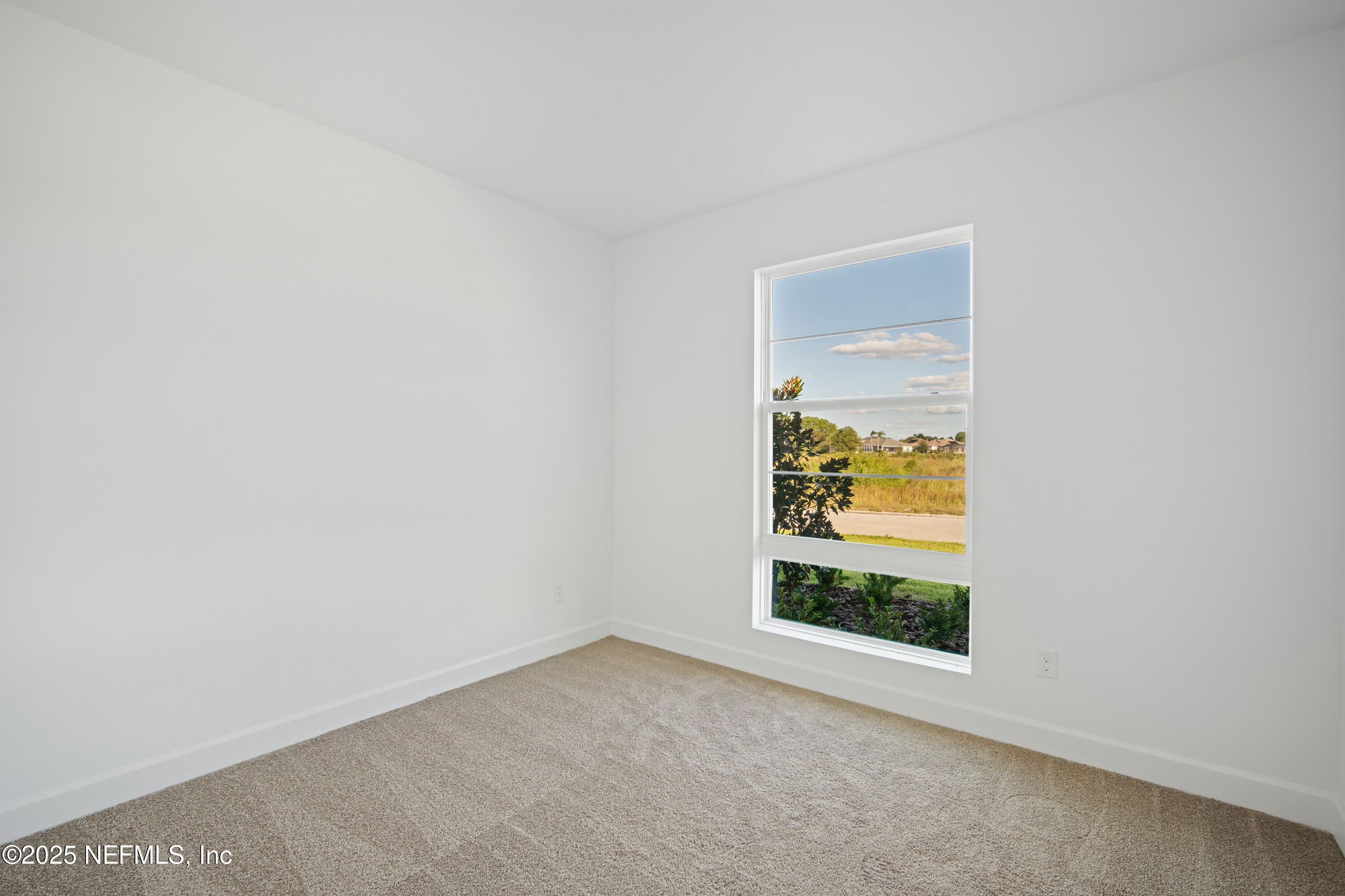 9253 Players Drive Weeki Wachee, FL 34613 - Photo 8 of 30 a view of an empty room and window