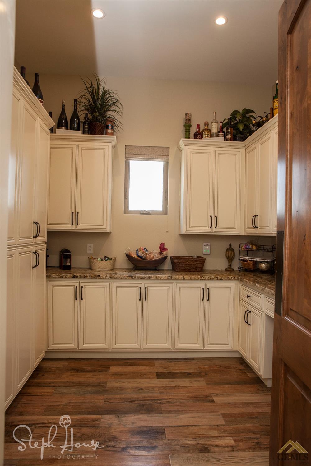 Undisclosed Address Arroyo Grande, CA 93420 - Photo 16 of 39 a kitchen with stainless steel appliances granite countertop a sink a stove a microwave and cabinets