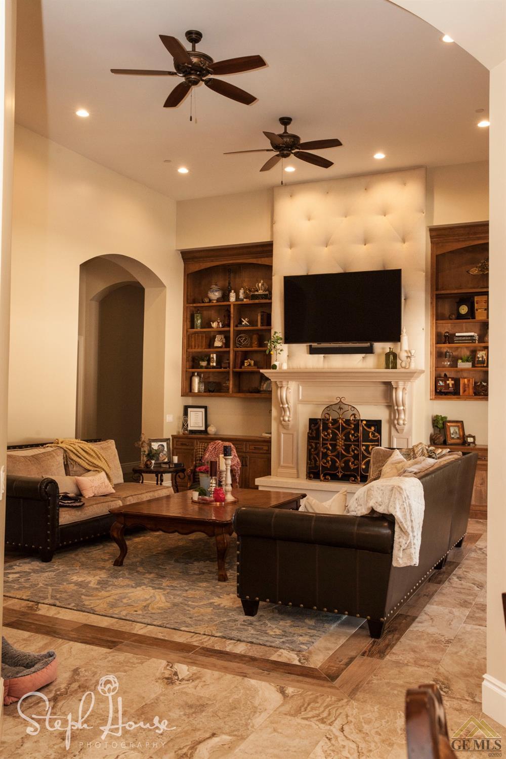 Undisclosed Address Arroyo Grande, CA 93420 - Photo 20 of 39 a living room with fireplace furniture and a flat screen tv